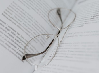 Glasses in the fold of an open book