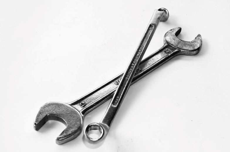 Two spanners crossed against a white background